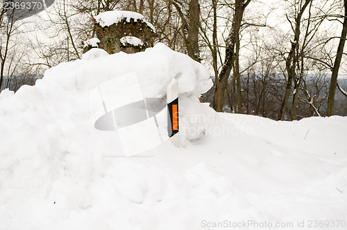 Image of light reflector pillar snow road side north winter 