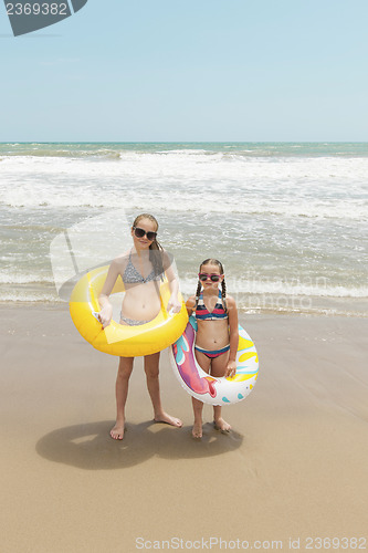 Image of Two girls playing on the beach