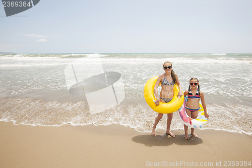 Image of Two girls playing on the beach