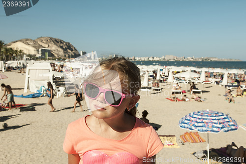 Image of Girl with shades on a beach