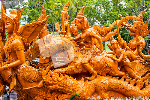 Image of Carving a large candle, Thai art form of wax at Ubonratchathani 