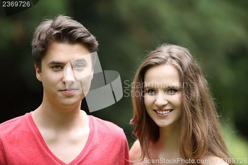 Image of Smiling young teenage boy and girl
