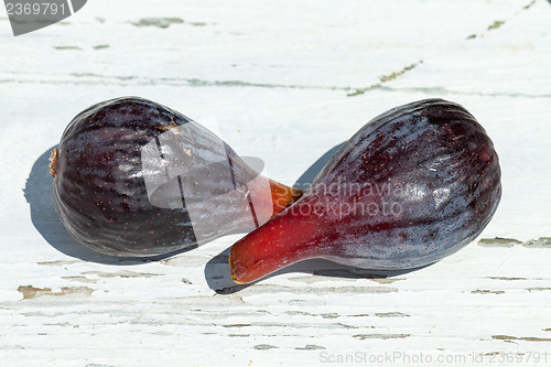 Image of Fresh fig fruits on white wooden background