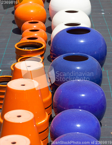 Image of Colorful ceramic pots in market
