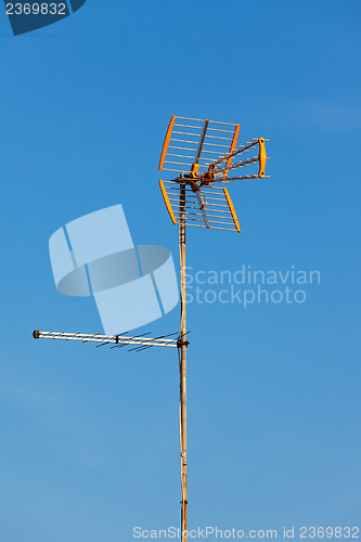 Image of Television aerial against a blue sky