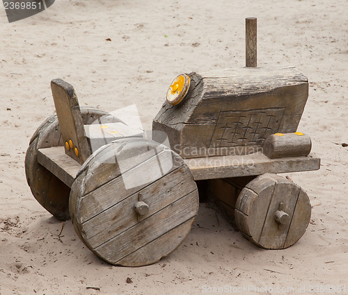 Image of Wooden toy tractor with trailer