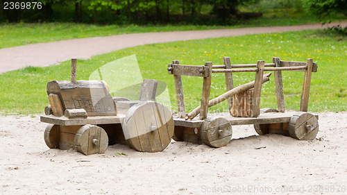 Image of Wooden toy tractor with trailer