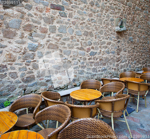 Image of summer cafe near the ancient stone wall
