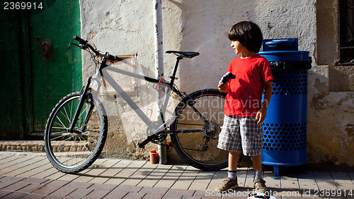 Image of boy in a red T-shirt 