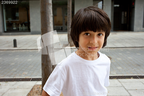 Image of boy in a white t-shirt