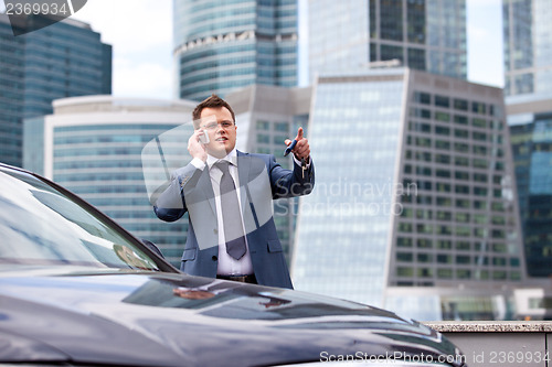 Image of businessman  pointing her finger