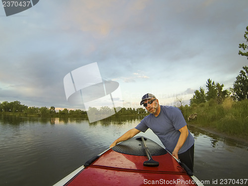 Image of launching stand up paddleboard