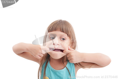 Image of Little girl making a strange face on white background