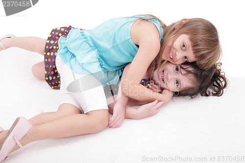 Image of two kids play together, isolated on white background 