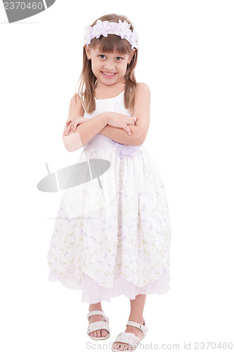 Image of Full length portrait of a little girl standing with folded hands