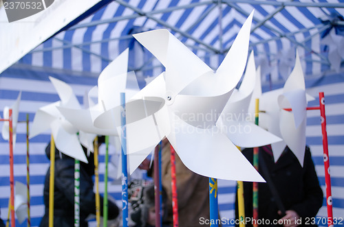 Image of paper windmill  donation charity event poor kids 