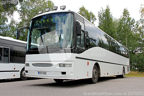 Image of White Bus Close up