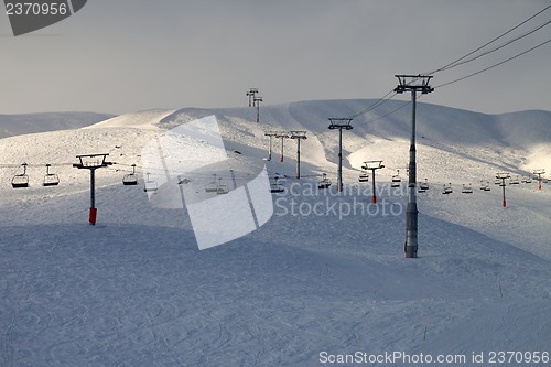 Image of Ski slope with chair-lift in evening