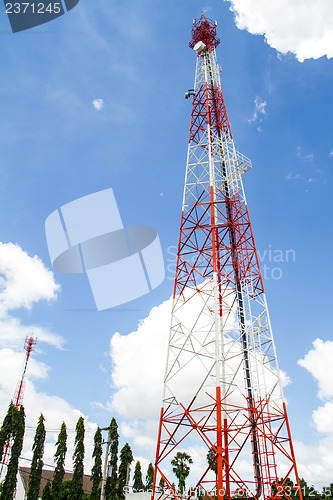 Image of Telecommunications tower with blue sky and cloud