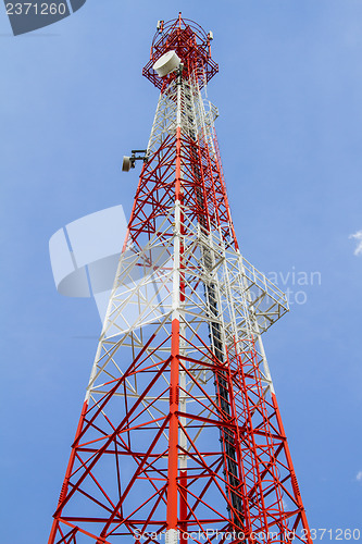 Image of Telecommunications tower with blue sky and cloud