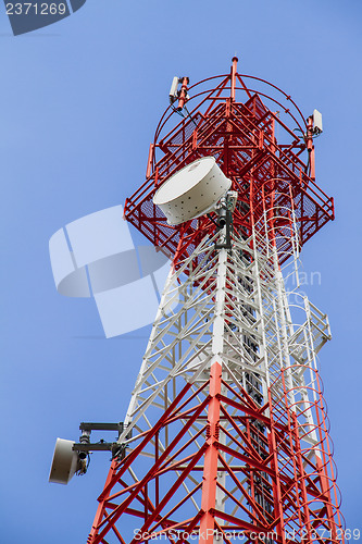 Image of Telecommunications tower with blue sky and cloud