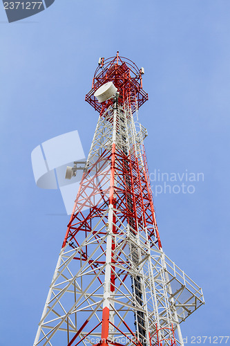 Image of Telecommunications tower with blue sky and cloud