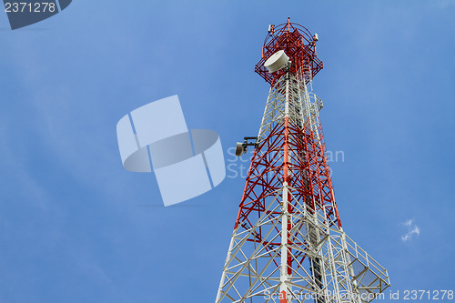 Image of Telecommunications tower with blue sky and cloud