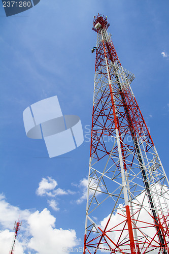 Image of Telecommunications tower with blue sky and cloud