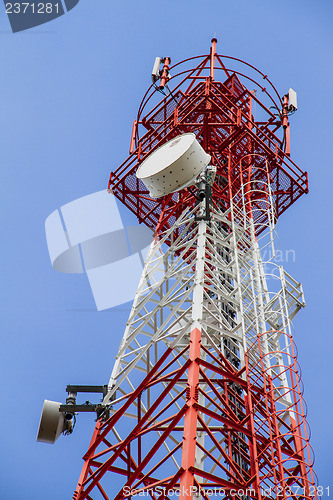 Image of Telecommunications tower with blue sky and cloud