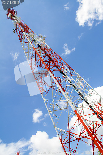 Image of Telecommunications tower with blue sky and cloud