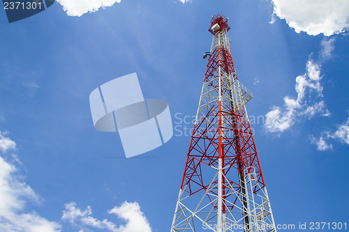 Image of Telecommunications tower with blue sky and cloud