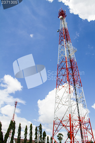 Image of Telecommunications tower with blue sky and cloud