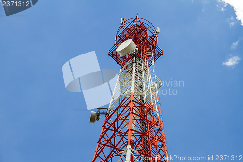 Image of Telecommunications tower with blue sky and cloud