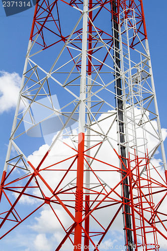 Image of Telecommunications tower with blue sky and cloud