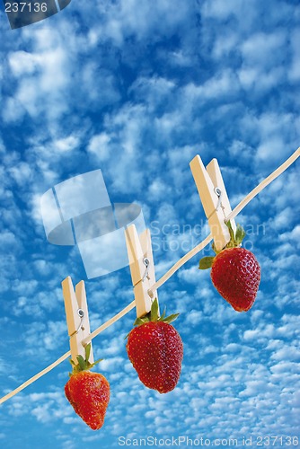 Image of strawberry's on cloudy sky