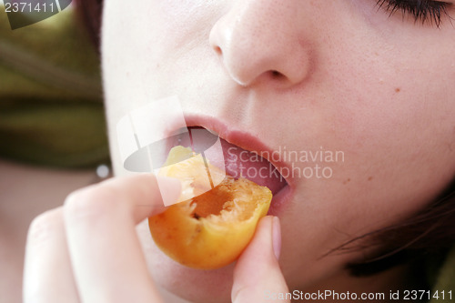 Image of Women with apricot 