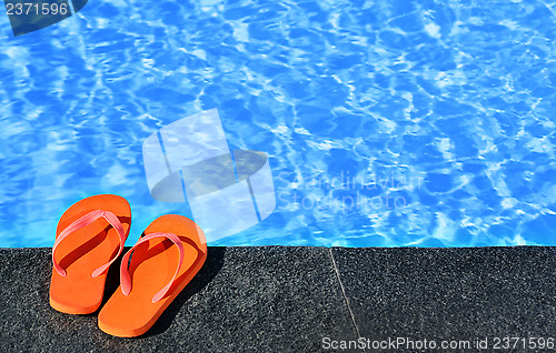 Image of sandals by a pool