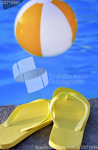 Image of sandals by a pool