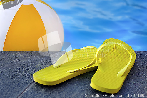 Image of 	sandals by a pool