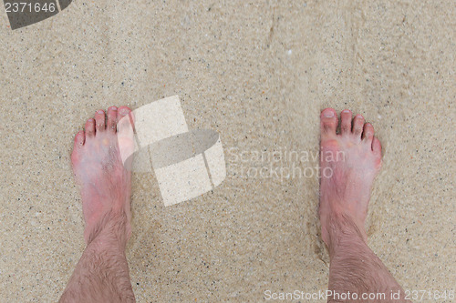 Image of Feet standing still on a beach