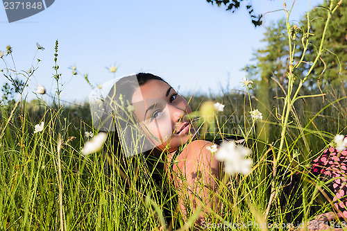 Image of The girl in the grass