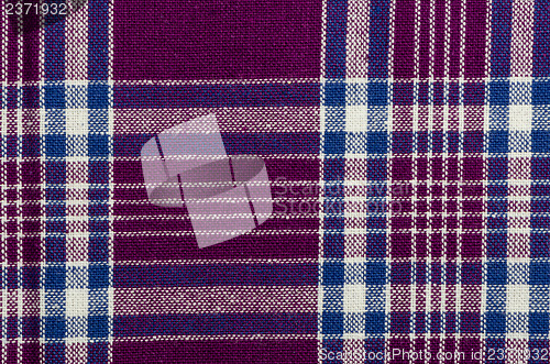 Image of Blue, purple and white plaid textile