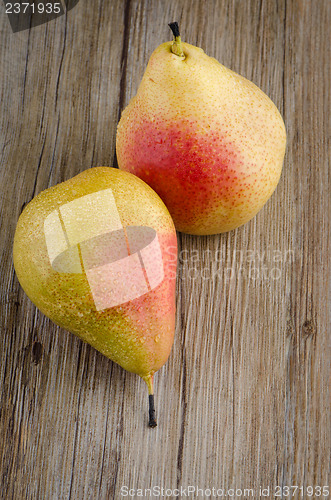 Image of Pears in a old wooden table