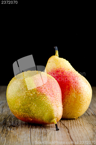 Image of Pears in a old wooden table