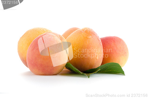 Image of Sweet peaches with leafs