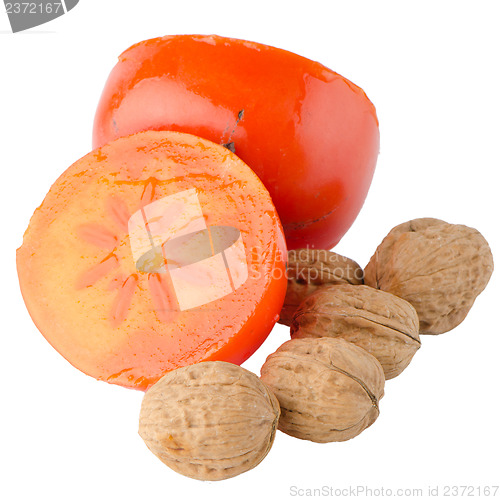 Image of Ripe persimmons and nuts