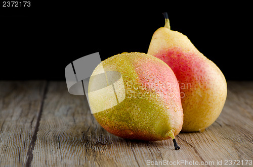 Image of Pears in a old wooden table