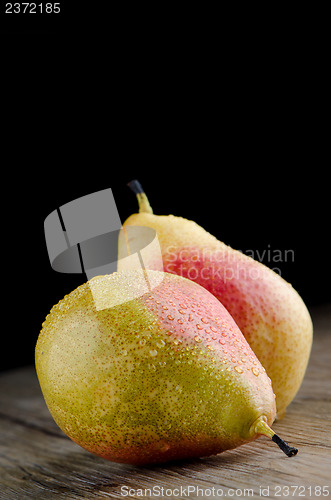 Image of Pears in a old wooden table