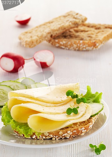 Image of bread with cheese and vegetables