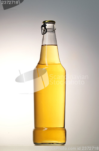 Image of beer bottle on grey background